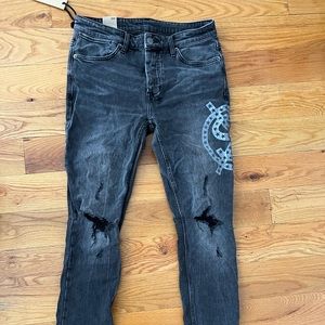Ksubi slim cut jeans with print on thigh and knee details